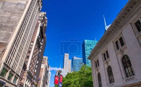 Photo for New York City - June 2013: Buildings in Bryant Park. - Royalty Free Image