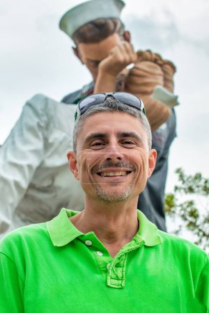 Photo for A happy man in front of Unconditional Surrender Statue in Sarasota, Florida. - Royalty Free Image