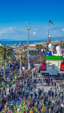 Photo for Viareggio, Italy - February 10, 2013: Crowd along the city promenade attending the Carnival Float Parade, aerial view from a high vantage point - Royalty Free Image