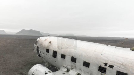 Photo for Aerial view of United States Navy DC plane wreck on the black beach at Solheimasandur. - Royalty Free Image