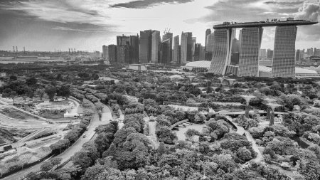 Marina Barrage, Singapore: Aerial view of cityscape and coastline on a overcast afternoon.