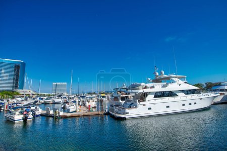 Photo for San Diego - July 30, 2017: Tourists, streets and buildings along Seaport Village and Embarcadero Park. - Royalty Free Image