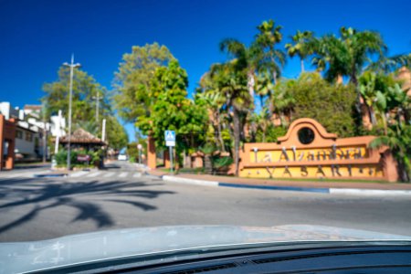 Photo for Marbella, Spain - April 7, 2023: A long boulevard near the ocean on a sunny spring day. - Royalty Free Image