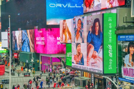 Photo for New York City - November 30, 2018: Tourists in Times Square in the morning. - Royalty Free Image