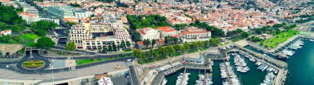 Photo for Funchal, Madeira. Aerial view of city center from a drone flying over the port. - Royalty Free Image