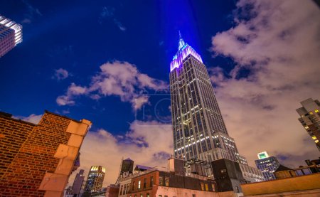 Photo for New York City - June 2013: The Empire State Building is a city symbol. - Royalty Free Image