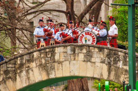 Photo for San Antonio, TX - March 16, 2008: Tourists and locals along the city river on St Patricks Day. - Royalty Free Image