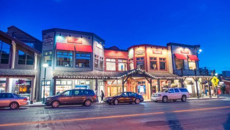 Photo for Jackson Hole, WY - July 11, 2019: City streets and cars at sunset. - Royalty Free Image