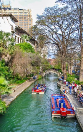 Photo for San Antonio, TX - March 16, 2008: Tourists and locals along the city river on a boat tour. - Royalty Free Image