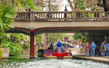 Photo for San Antonio, TX - March 16, 2008: Tourists and locals along the city river on a boat tour. - Royalty Free Image