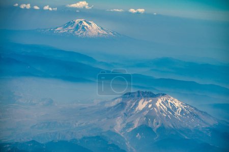 Aerial view of Mt St Helens and Mt Rainier from the airplane.