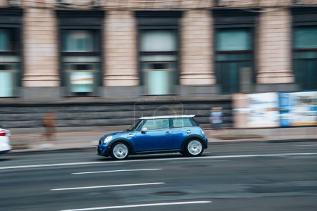 Photo for Ukraine, Kyiv - 2 August 2021: Blue MINI Hatch car moving on the street. Editorial - Royalty Free Image