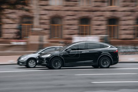 Photo for Ukraine, Kyiv - 2 August 2021: Black TESLA Model X car moving on the street. Editorial - Royalty Free Image