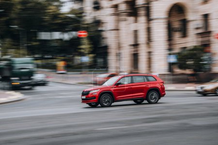 Photo for Ukraine, Kyiv - 2 August 2021: Red Skoda Kodiaq car moving on the street. Editorial - Royalty Free Image