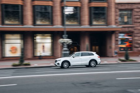 Photo for Ukraine, Kyiv - 2 August 2021: White Volkswagen Touareg car moving on the street. Editorial - Royalty Free Image