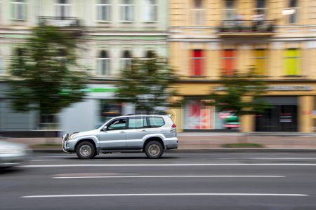 Foto de Ukraine, Kyiv - 2 August 2021: Silver Toyota Land Cruiser Prado car moving on the street. Editorial - Imagen libre de derechos