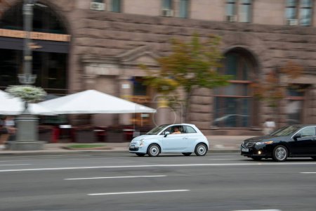Photo for Ukraine, Kyiv - 2 August 2021: Light Blue FIAT 500 car moving on the street. Editorial - Royalty Free Image