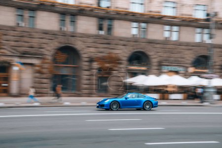 Photo for Ukraine, Kyiv - 2 August 2021: Blue Porsche 911 car moving on the street. Editorial - Royalty Free Image