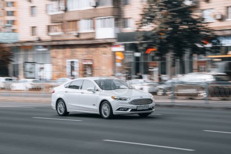 Photo for Ukraine, Kyiv - 16 Jule 2021: White Ford car moving on the street. Editorial - Royalty Free Image