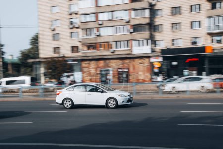 Photo for Ukraine, Kyiv - 16 Jule 2021: White Ford Focus car moving on the street. Editorial - Royalty Free Image
