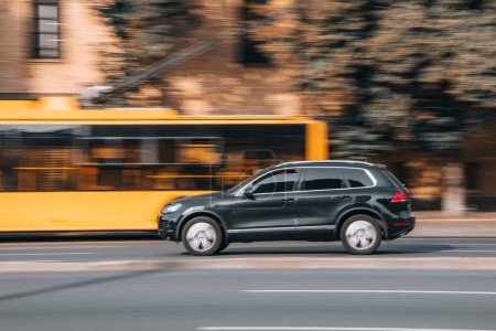 Photo for Ukraine, Kyiv - 16 Jule 2021: Black Volkswagen Touareg car moving on the street. Editorial - Royalty Free Image