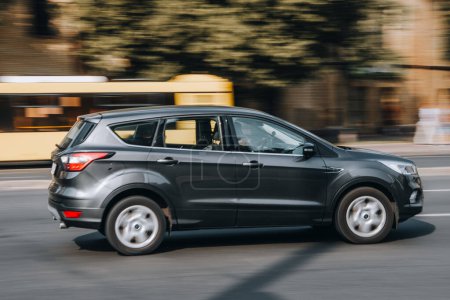 Photo for Ukraine, Kyiv - 16 Jule 2021: Gray Ford Kuga car moving on the street. Editorial - Royalty Free Image