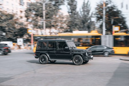 Photo for Ukraine, Kyiv - 16 Jule 2021: Black Mercedes-Benz G-Class car moving on the street. Editorial - Royalty Free Image