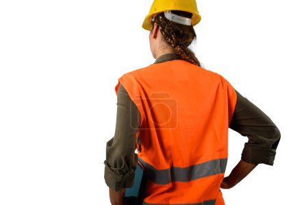 Téléchargez les photos : Femme avec casque et veste qui travaille dans un entrepôt - en image libre de droit