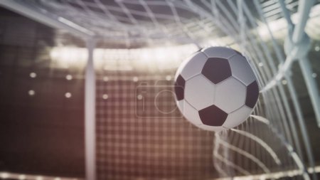 Foto de Closeup of a soccer ball against the net - Imagen libre de derechos