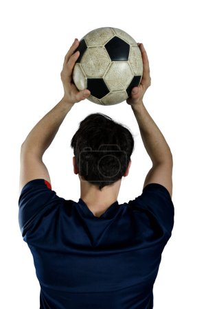 Téléchargez les photos : Football player throws a soccerball at the stadium - en image libre de droit