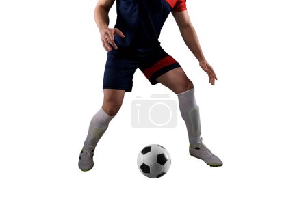 Photo for Football player chases a soccerball at the stadium - Royalty Free Image
