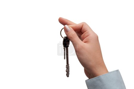Foto de Hand holds home keys. concept of buying or selling house - Imagen libre de derechos