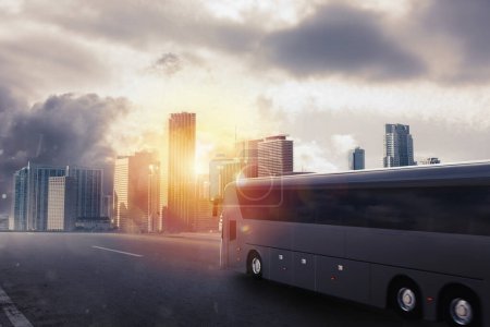 Téléchargez les photos : Bus moving on the road in a cityscape at sunset - en image libre de droit
