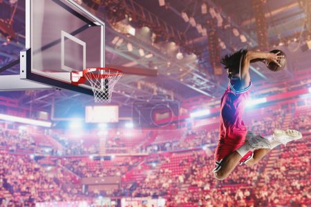 Téléchargez les photos : Joueur de basket-ball sautant pour faire un panier - en image libre de droit