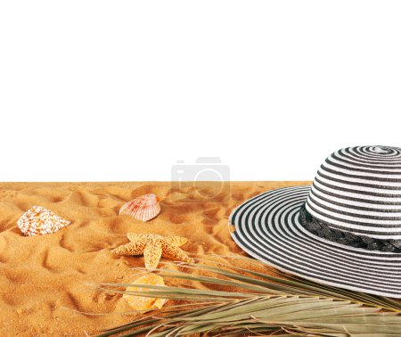 Photo for Female hat on a golden sand at the beach - Royalty Free Image
