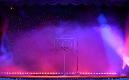 Photo for Theatre show with colored spotlights and microphone - Royalty Free Image