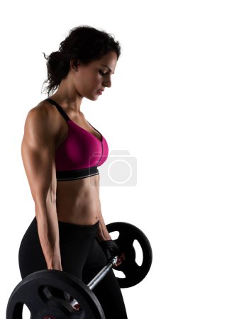 Photo for Woman trains in the gym with weights - Royalty Free Image