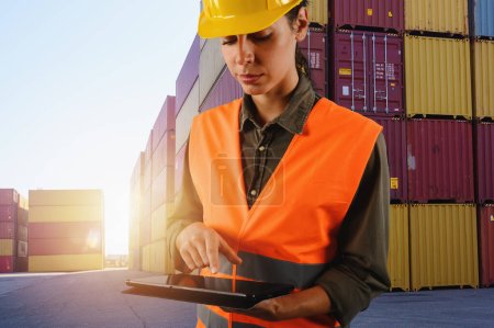 Photo for Woman works as a warehouse worker in a cargo depot - Royalty Free Image