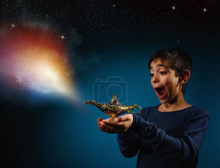 Child with magic Aladin lamp in hand