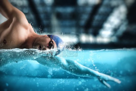 Photo for Sporty man with goggles swims fast during a sport competition - Royalty Free Image