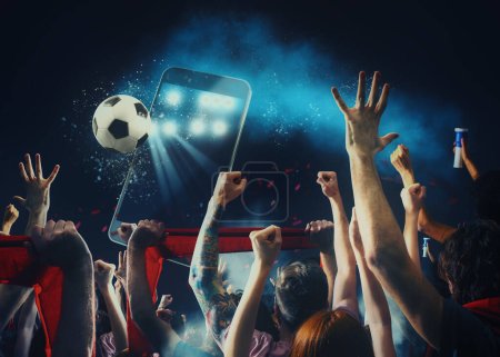 Soccer fans, cellphone and ball on dark background