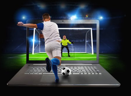 Photo for Streaming of a soccer player match on a laptop - Royalty Free Image