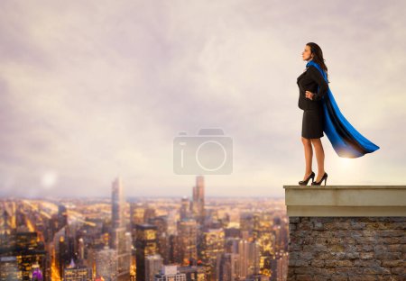 Photo for Woman with a cloak acts like a super hero - Royalty Free Image