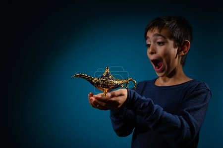 Photo for Child with magic Aladin lamp in hand - Royalty Free Image