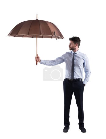 Photo for Man covers something with a big umbrella - Royalty Free Image
