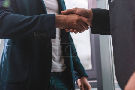 Photo for Handshaking of business people in office as teamwork and partnership concept - Royalty Free Image