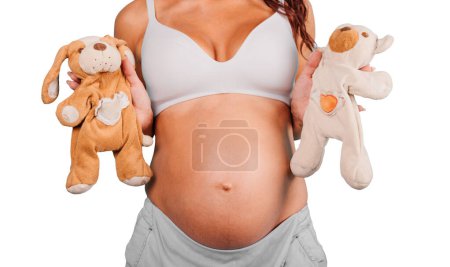 Photo for Woman expects a child and play with teddy bears - Royalty Free Image