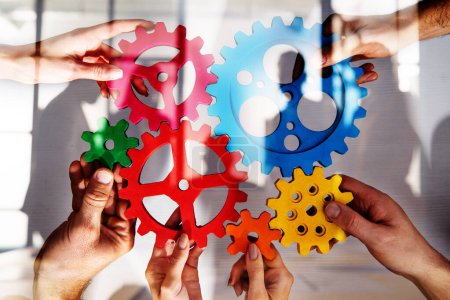 Photo for Business people connect pieces of gears. Partnership and integration concept - Royalty Free Image