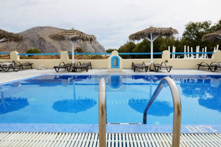 Photo for The volcano view swimming pool, Santorini island, Greece - Royalty Free Image