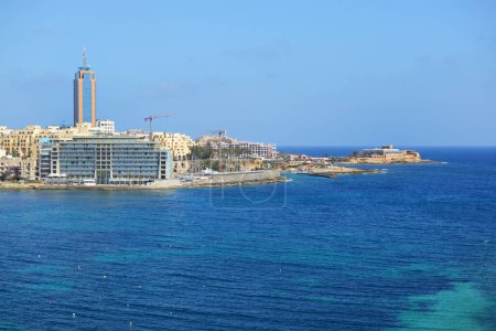 Photo for SLIEMA, MALTA - APRIL 21: The view on hotels and beach on April 21, 2015 in Sliema, Malta. More then 1,6 mln tourists is expected to visit Malta in year 2015. - Royalty Free Image